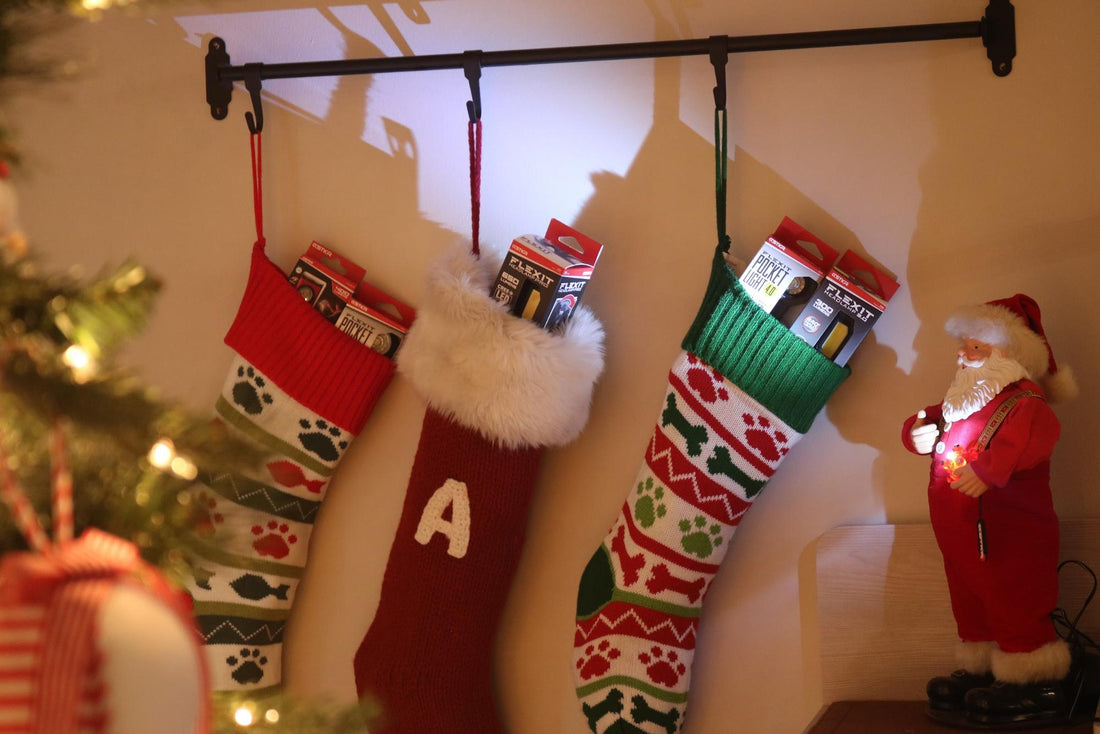 Christmas stockings on the wall filled with STKR lights