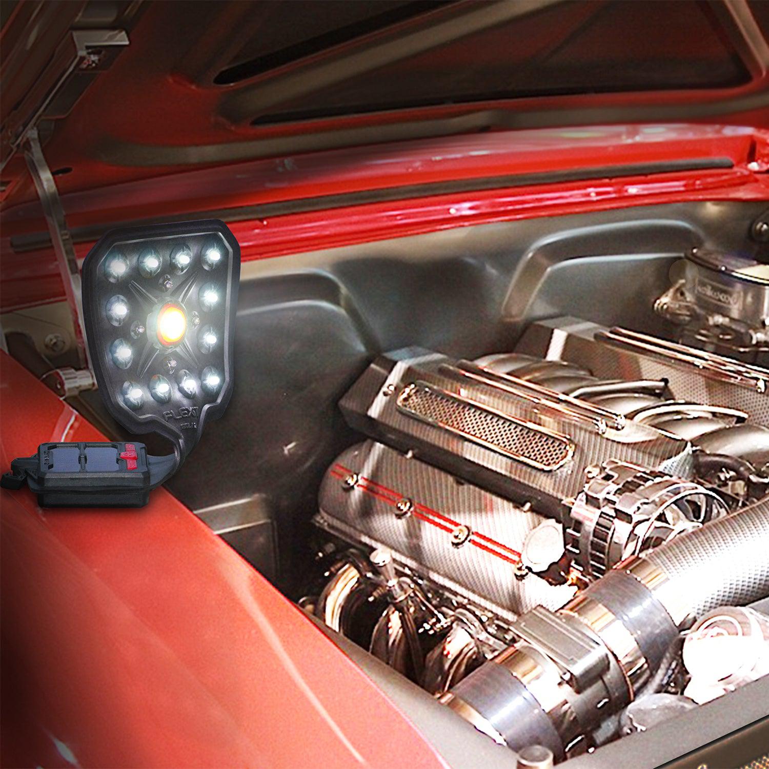 Flexit solar sitting on a front fender illuminating a shiny engine and engine bay