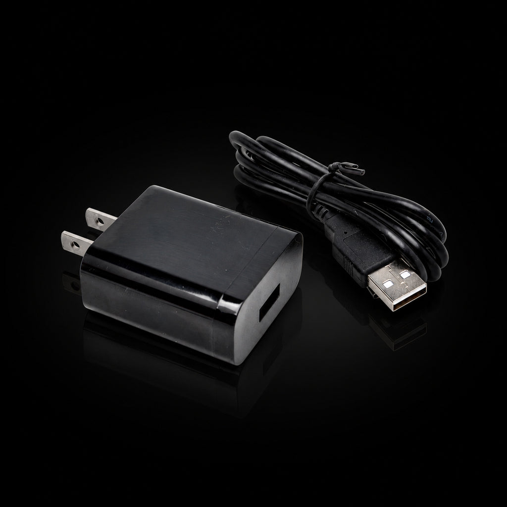 Micro USB cable with wall power adapter on black