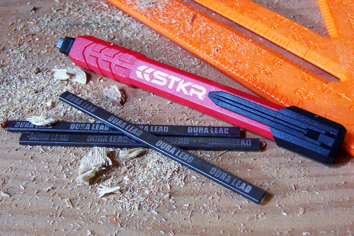STKR Mechanical Carpenter Pencil and DURA LEAD refills on wood shavings